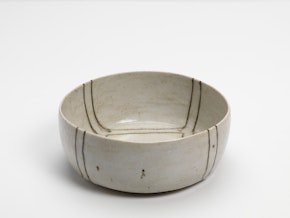 Grey and white bowl with black and brown lines